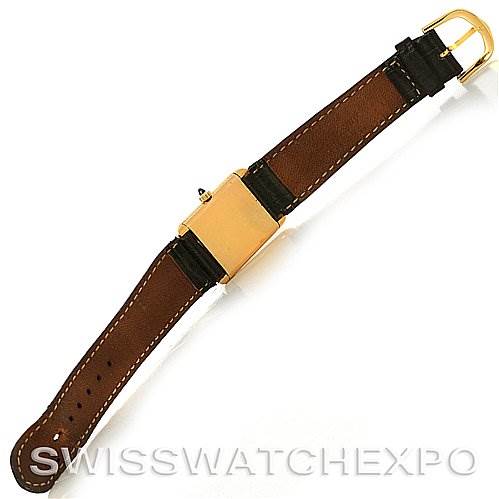 The image shows the back view of a Cartier Tank Classic Yellow Gold White Dial Yellow Gold White Dial watch with a brown leather strap and a gold buckle.