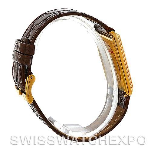 The image shows a Cartier Tank Classic Men's Yellow Gold White Dial Men's Yellow Gold White Dial watch from a side angle, highlighting the leather strap and part of the gold casing.