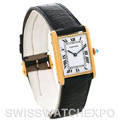 The image shows a Cartier Tank Classic Yellow Gold White Dial Yellow Gold White Dial watch at a three-quarter angle, highlighting its face, bezel, and leather strap.