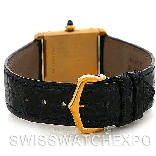 This image shows the back of the Cartier Tank Classic Yellow Gold White Dial Yellow Gold White Dial watch, including the caseback, leather strap, and buckle clasp.