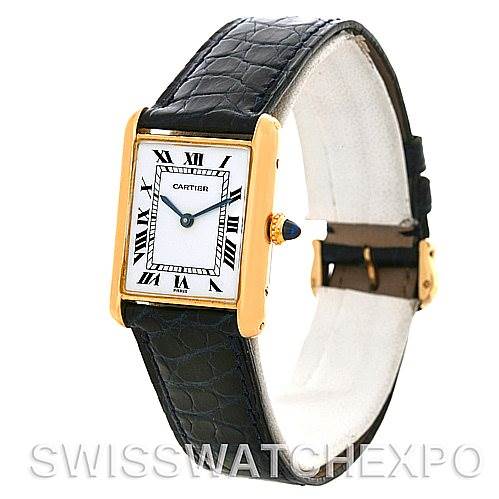 The image shows a Cartier Tank Classic Yellow Gold White Dial Yellow Gold White Dial watch at an angle displaying its dial, black leather strap, and gold casing.