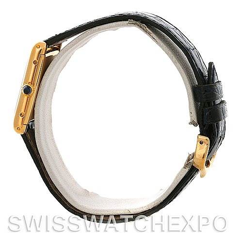 The image shows a side view of the Cartier Tank Classic Yellow Gold White Dial Yellow Gold White Dial watch, highlighting the gold case and black leather strap with the buckle.