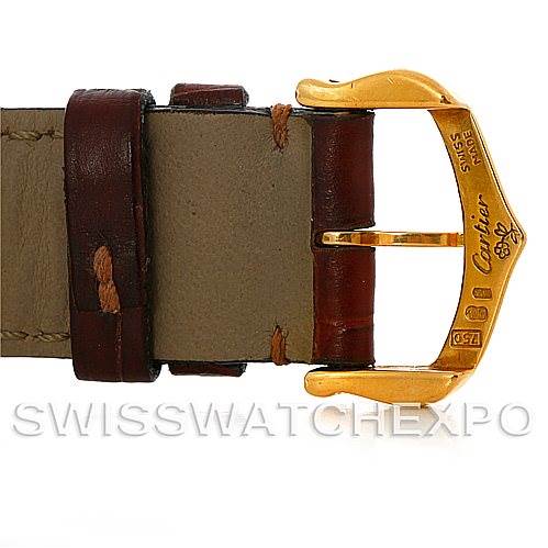 This image shows the buckle and part of the leather strap of a Cartier Tank Classic Men's Yellow Gold White Dial Men's Yellow Gold White Dial watch.