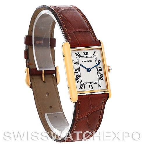 The image shows a Cartier Tank Classic Men's Yellow Gold White Dial Men's Yellow Gold White Dial watch at an angle highlighting its rectangular face, roman numerals, and brown leather strap.