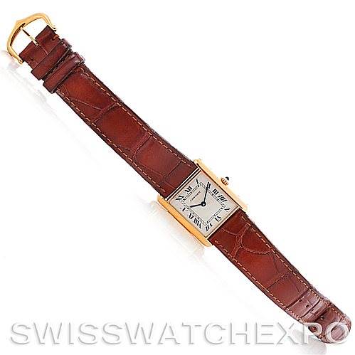 The image shows a top view of a Cartier Tank Classic Men's Yellow Gold White Dial Men's Yellow Gold White Dial watch with a brown leather strap and gold case.