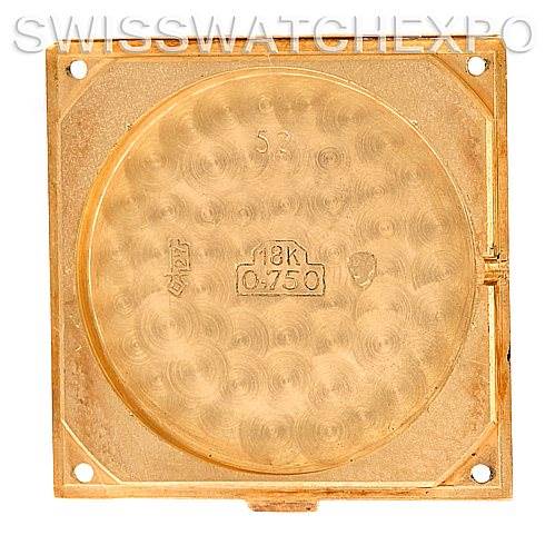 This image shows the back casing interior of a Tank Classic model watch by Cartier, highlighting the 18K gold stamp.