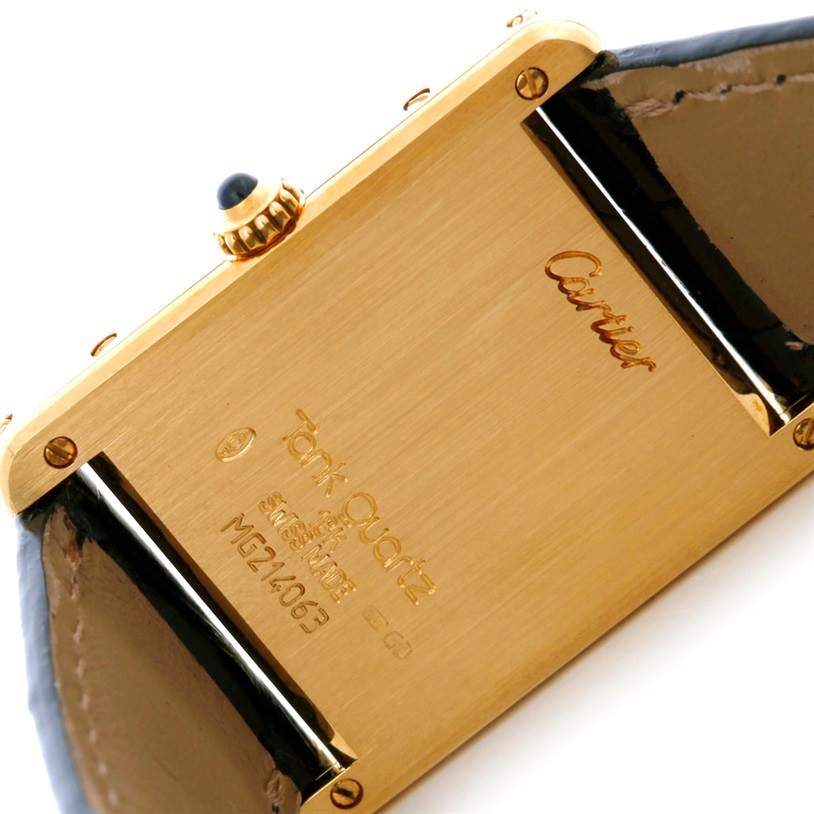 This image shows the back case and part of the strap of a Cartier Tank Classic Men's Yellow Gold White Dial Men's Yellow Gold White Dial watch at a slight angle.