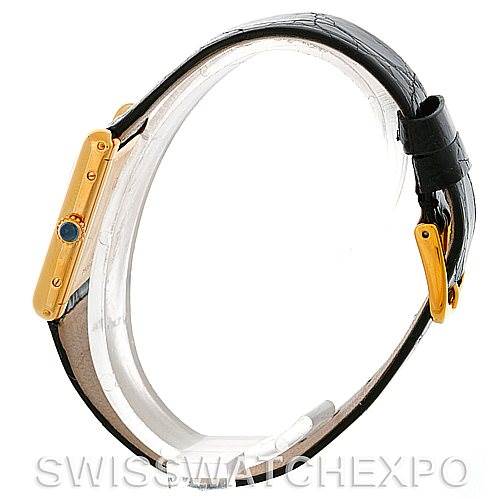 The image shows a side view of the Cartier Tank Classic Men's Yellow Gold White Dial Men's Yellow Gold White Dial watch, highlighting the crown and strap details.