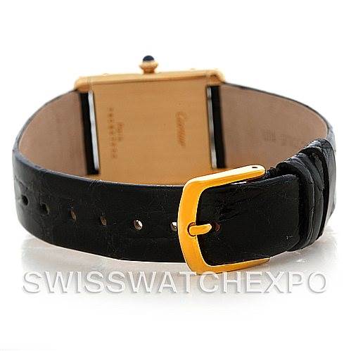 This image shows the back view of a Cartier Tank Classic Men's Yellow Gold White Dial Men's Yellow Gold White Dial watch, featuring its black leather strap and a gold buckle.