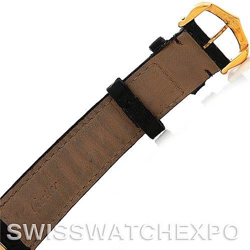 The image shows the strap with a gold-colored buckle of a Cartier Tank Classic Men's Yellow Gold White Dial Men's Yellow Gold White Dial watch, viewed from the bottom side.