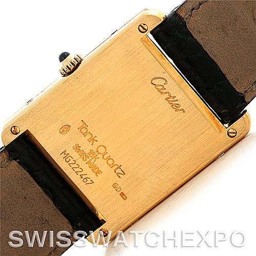 The image shows the back case and part of the strap of a Cartier Tank Classic Men's Yellow Gold White Dial Men's Yellow Gold White Dial watch.