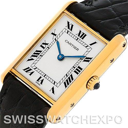 This image shows a close-up angle of the Cartier Tank Classic Men's Yellow Gold White Dial Men's Yellow Gold White Dial watch, displaying the face, bezel, crown, and part of the strap.