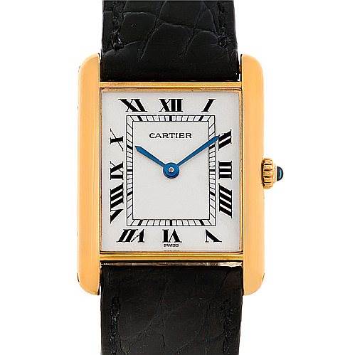 The image shows a front view of a Cartier Tank Classic Men's Yellow Gold White Dial Men's Yellow Gold White Dial watch, featuring Roman numerals, blue hands, a gold case, and a black leather strap.