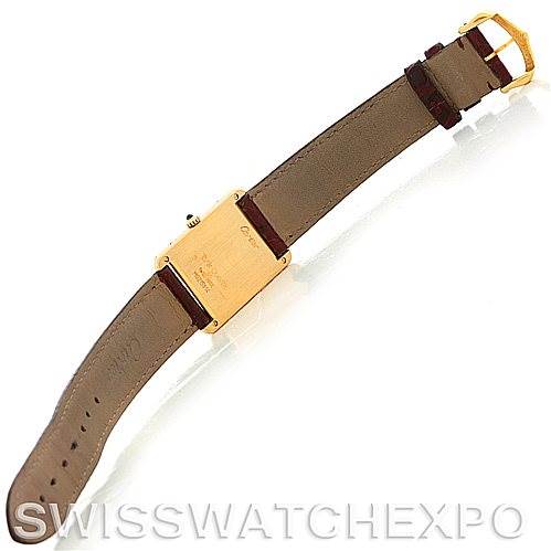 The image shows the back view of a Cartier Tank Classic MG215914 Men's Yellow Gold White Dial MG215914 Men's Yellow Gold White Dial watch, highlighting its strap, buckle, and case back.