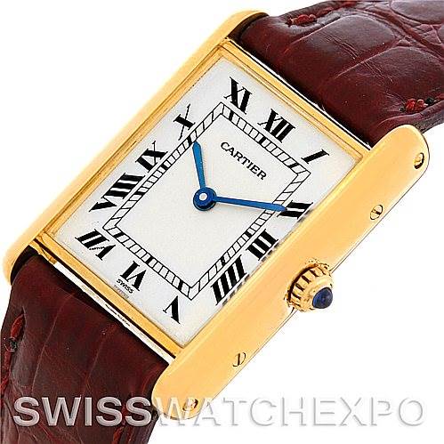 The image shows a close-up, angled view of the Cartier Tank Classic MG215914 Men's Yellow Gold White Dial MG215914 Men's Yellow Gold White Dial watch, highlighting the face, crown, and part of the strap.