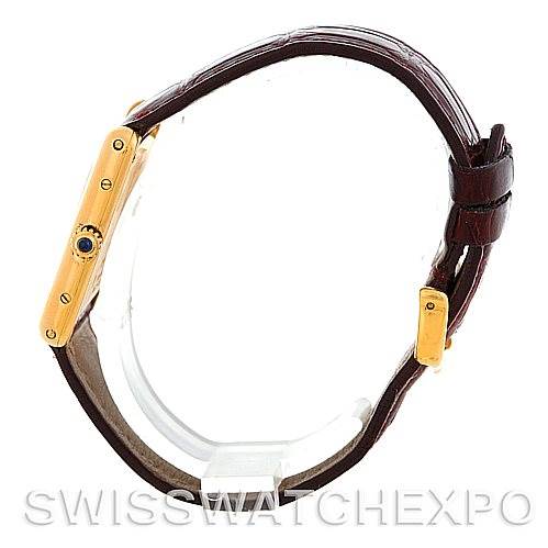 The image shows a side view of the Cartier Tank Classic MG215914 Men's Yellow Gold White Dial MG215914 Men's Yellow Gold White Dial watch highlighting the bezel, crown, and brown leather strap.