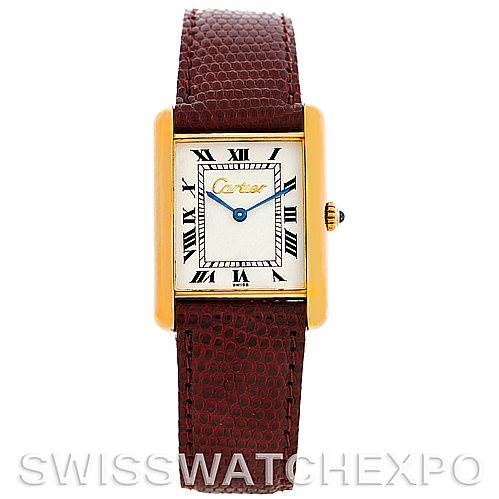 This image shows a frontal view of a Cartier Tank Classic Men
s Yellow Gold Silver Dial Men
s Yellow Gold Silver Dial watch with a brown leather strap and gold rectangular case.