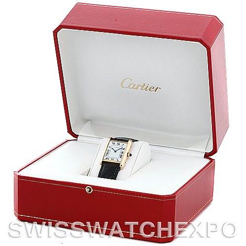 The image shows a Cartier Tank Classic Men
s Yellow Gold Silver Dial Men
s Yellow Gold Silver Dial watch in a red Cartier presentation box, viewed from the front.