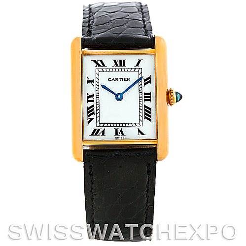 The image shows a frontal view of a Cartier Tank Classic Men
s Yellow Gold Silver Dial Men
s Yellow Gold Silver Dial watch, highlighting its dial, strap, and crown with a blue cabochon.