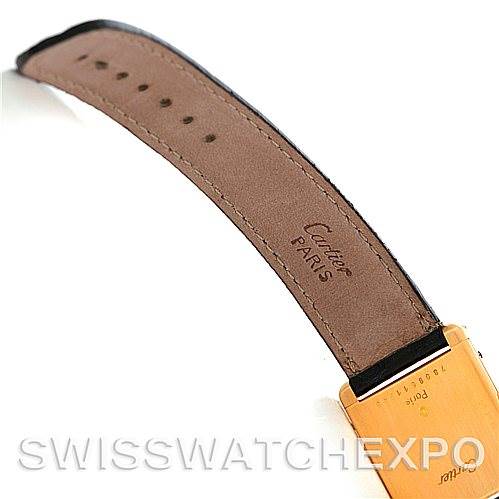 The image shows the strap and clasp of a Cartier Tank Classic Men
s Yellow Gold Silver Dial Men
s Yellow Gold Silver Dial watch, photographed from the side and back.