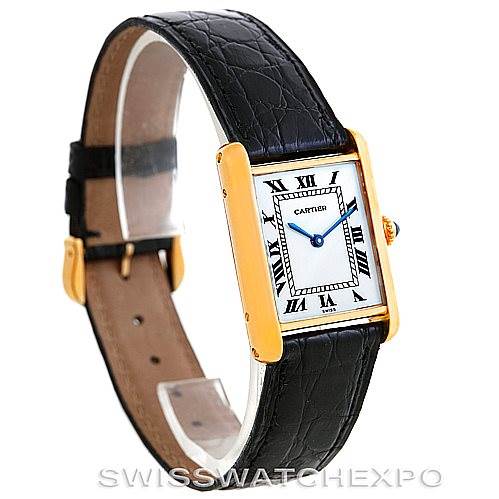 The Cartier Tank Classic Men's Yellow Gold White Dial Men's Yellow Gold White Dial watch is shown at a slight angle with its face, strap, and gold casing visible.