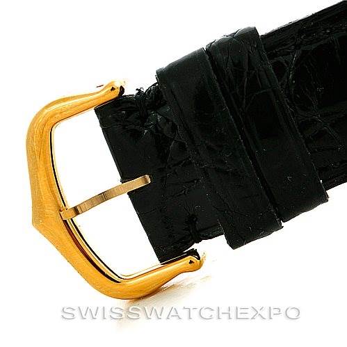 The image shows a close-up of the clasp and leather strap of a Cartier Tank Classic Men's Yellow Gold White Dial Men's Yellow Gold White Dial watch.