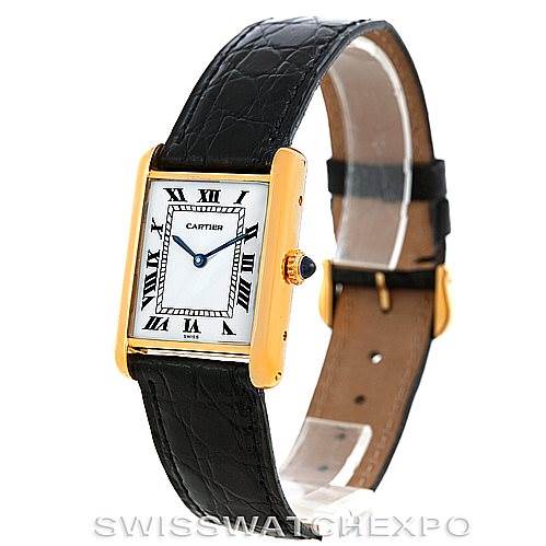 The Cartier Tank Classic Men's Yellow Gold White Dial Men's Yellow Gold White Dial watch is shown at an angled side view highlighting its face, leather band, and gold case.
