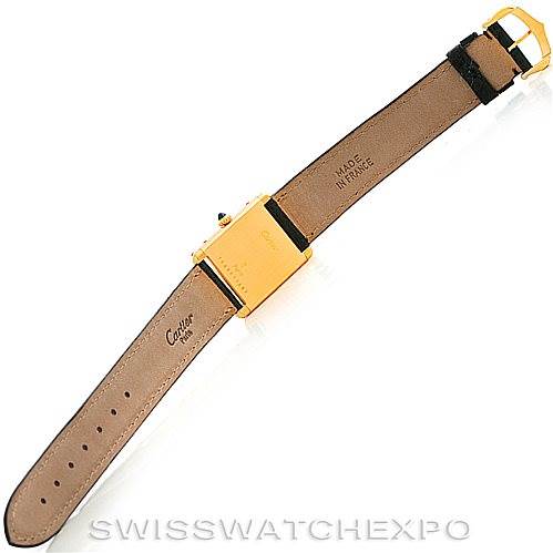 The image shows the back view of a Cartier Tank Classic Men's Yellow Gold White Dial Men's Yellow Gold White Dial watch, highlighting its leather strap, buckle, and case back.