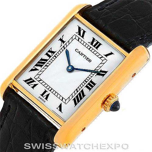 This image shows a close-up, angled view of the Cartier Tank Classic Men's Yellow Gold White Dial Men's Yellow Gold White Dial watch, highlighting its face and crown.
