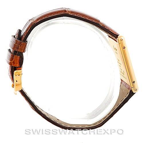 The image shows a side view of a Cartier Tank Classic Men's Yellow Gold Silver Dial Men's Yellow Gold Silver Dial watch, highlighting the strap and the side of the case.