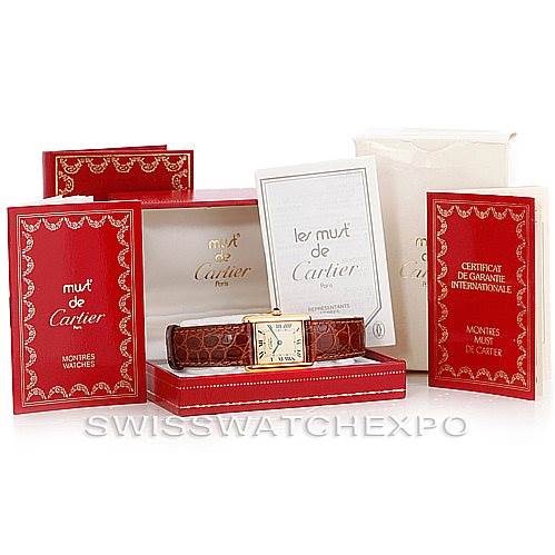 The image shows a Cartier Tank Classic W002953 Men's Yellow Gold Champagne Dial W002953 Men's Yellow Gold Champagne Dial watch, displayed with its original red and white packaging and booklets, photographed from the front.