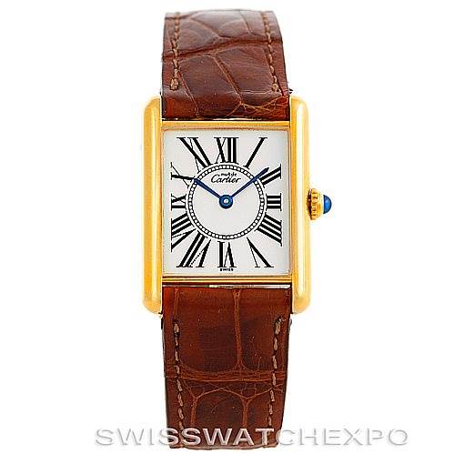 The Cartier Tank Classic W002953 Men's Yellow Gold White Dial W002953 Men's Yellow Gold White Dial watch is shown from a top-down angle, displaying the face, case, and leather strap.