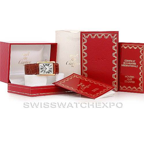 The image shows a Cartier Tank Classic W002953 Men's Yellow Gold White Dial W002953 Men's Yellow Gold White Dial watch in its open box with accompanying papers and certificates, all presented at an angled view.