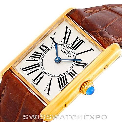 This image shows a Cartier Tank Classic W002953 Men's Yellow Gold White Dial W002953 Men's Yellow Gold White Dial watch at an angled close-up, highlighting the face, crown, and part of the leather strap.
