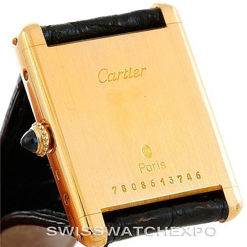 This image shows the back and side of the Cartier Tank Classic 7808613746 Men's Yellow Gold White Dial 7808613746 Men's Yellow Gold White Dial watch, including the crown and part of the leather strap.