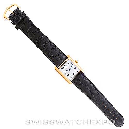 The image displays a Cartier Tank Classic 7808613746 Men's Yellow Gold White Dial 7808613746 Men's Yellow Gold White Dial watch from a top-down angle, showing the entire watch and its black leather strap with a gold buckle.