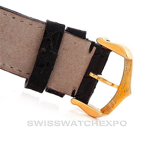 This image shows a close-up of the strap and gold buckle of a Cartier Tank Classic 7808613746 Men's Yellow Gold White Dial 7808613746 Men's Yellow Gold White Dial watch.