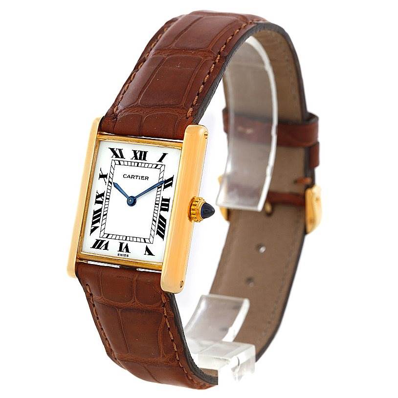 The image shows a Cartier Tank Classic Men
s Yellow Gold White Dial Men
s Yellow Gold White Dial watch at a slight angled view, displaying the face, case, crown, and leather strap.