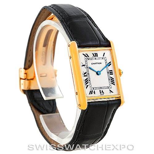 The Cartier Tank Classic Men's Yellow Gold Silver Dial Men's Yellow Gold Silver Dial watch is shown at a three-quarter angle, highlighting the watch face, bezel, and black leather strap.