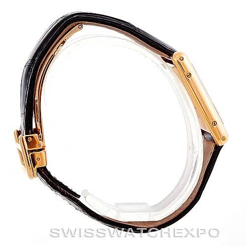 The image shows a side view of the Cartier Tank Classic Men's Yellow Gold Silver Dial Men's Yellow Gold Silver Dial model watch, highlighting the gold case and black leather strap.