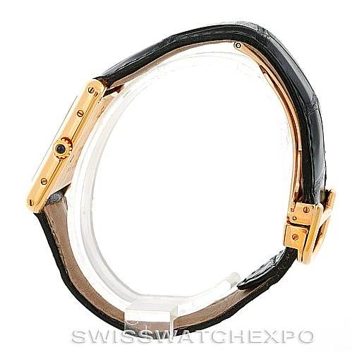 This is a side view of the Cartier Tank Classic Men's Yellow Gold Silver Dial Men's Yellow Gold Silver Dial watch, showing the case, crown, and part of the leather strap.