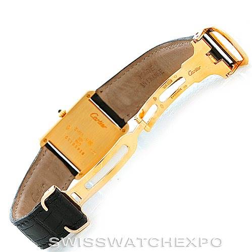 This image shows the back case and leather strap of the Cartier Tank Classic Men's Yellow Gold Silver Dial Men's Yellow Gold Silver Dial watch at an angle.
