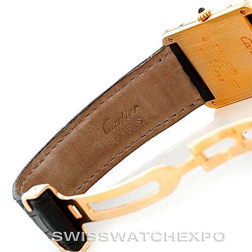 This image shows the back case and strap of the Cartier Tank Classic Men's Yellow Gold Silver Dial Men's Yellow Gold Silver Dial watch, highlighting the branded leather strap and gold case.