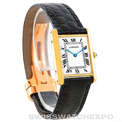 The image shows a Cartier Tank Classic Men's Yellow Gold White Dial Men's Yellow Gold White Dial watch at a three-quarter angle, displaying the face, strap, and clasp details.