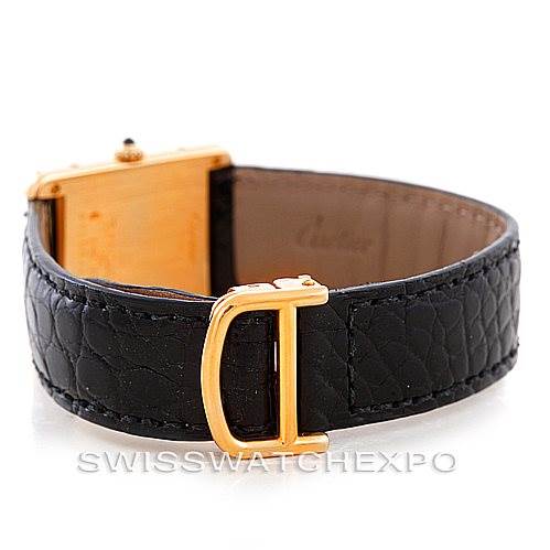 The image shows a Cartier Tank Classic Men's Yellow Gold White Dial Men's Yellow Gold White Dial watch's black leather strap and gold buckle from a slightly angled side view.