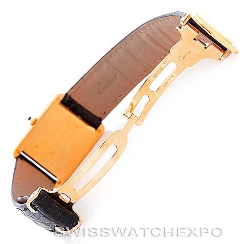 The image shows the clasp and underside of the strap of a Cartier Tank Classic Men's Yellow Gold White Dial Men's Yellow Gold White Dial watch at an angled view.