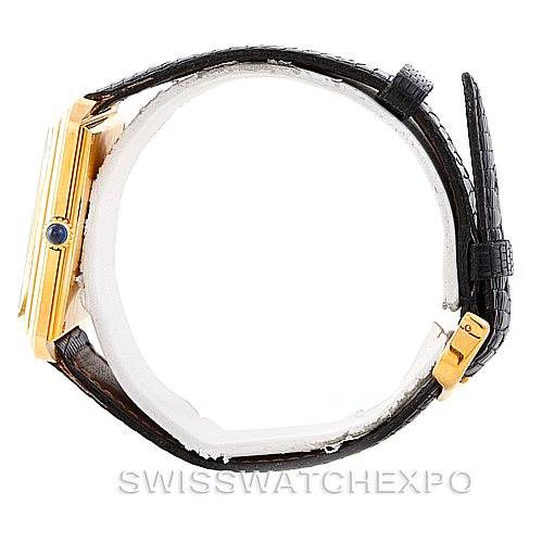 The image shows a side view of a Cartier Tank Classic Men's Yellow Gold White Dial Men's Yellow Gold White Dial watch, focusing on the case, crown, and alligator leather strap.