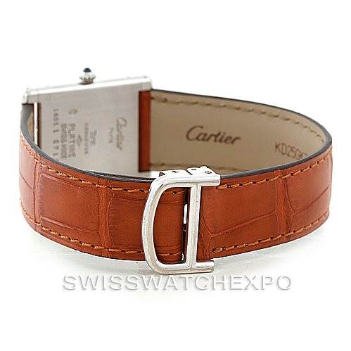 The image shows the rear view of a Cartier Tank Classic Men
s Platinum Silver Dial Men
s Platinum Silver Dial watch, highlighting its brown leather strap and buckle.