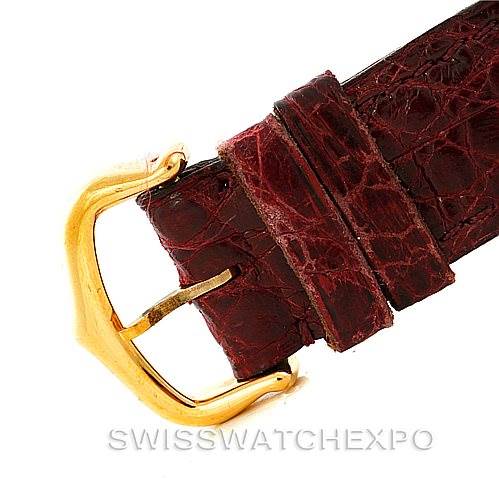 This image shows a close-up of the brown leather strap buckle of the Cartier Tank Classic 960655124 Men's Yellow Gold Silver Dial 960655124 Men's Yellow Gold Silver Dial watch.