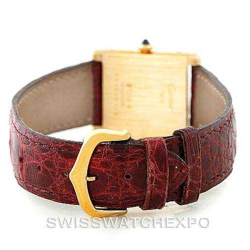 The image shows the Cartier Tank Classic 960655124 Men's Yellow Gold Silver Dial 960655124 Men's Yellow Gold Silver Dial watch from a rear angle, highlighting the leather strap and gold buckle.